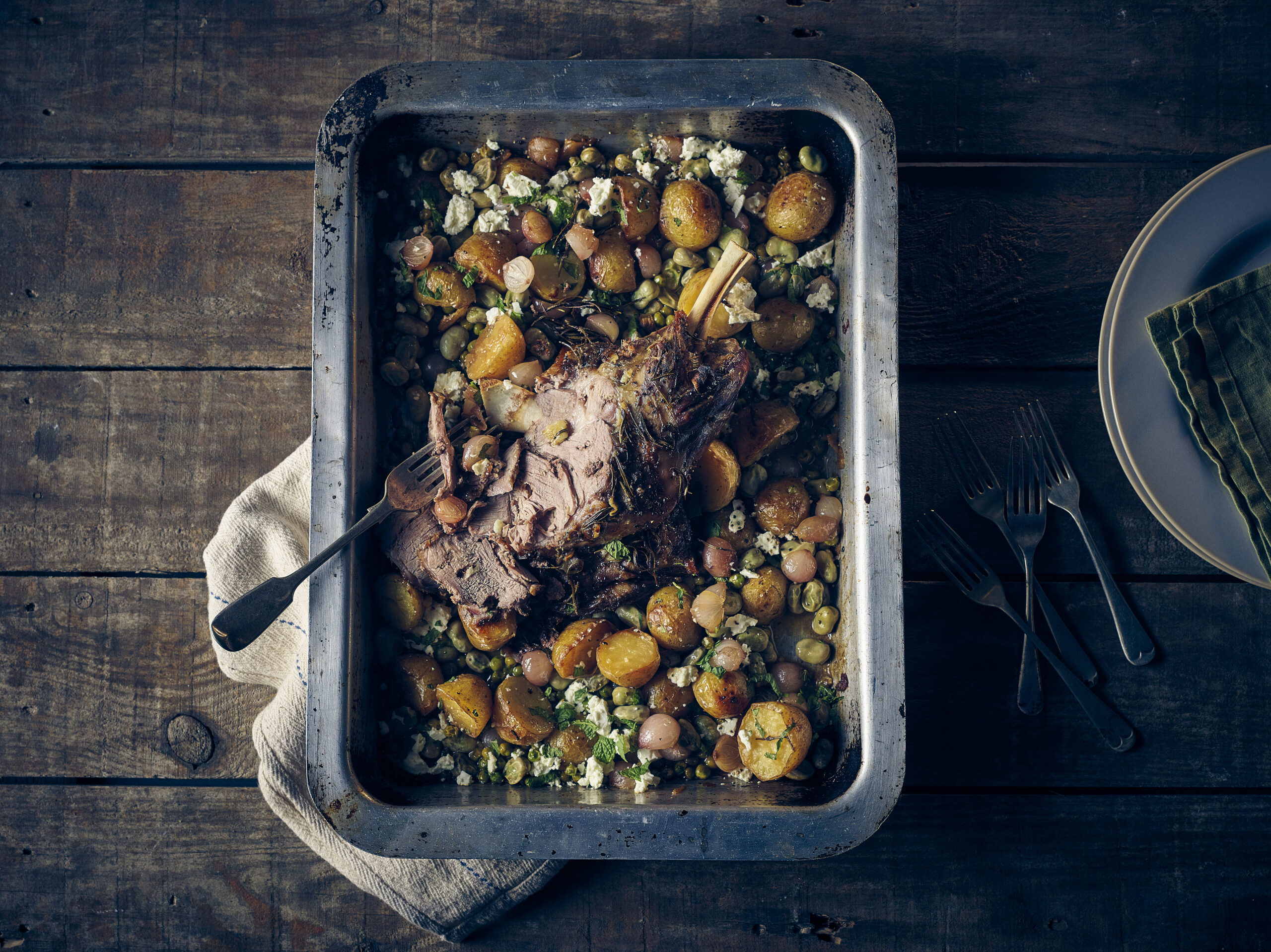 Slow Roast Lamb Shoulder with Onions & Peas - Stir it up Magazine